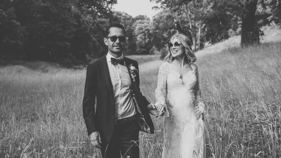 Black-and-white portrait of the bride and groom outdoors