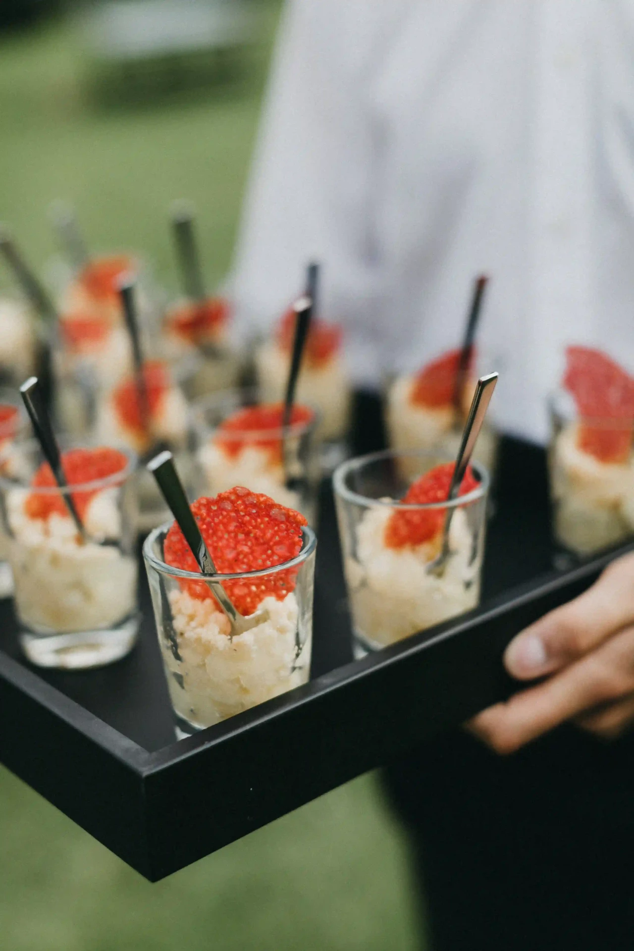 Glasses and small bites on a tray