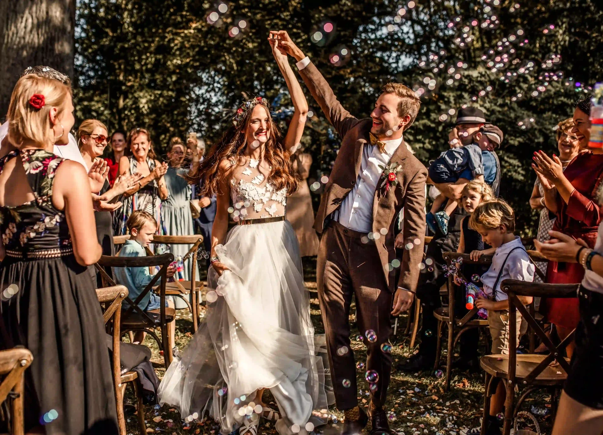 Wedding guests celebrating and dancing in the garden