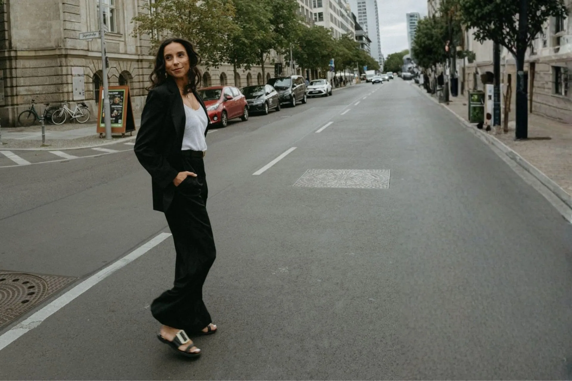 Woman wearing a black outfit on a city street