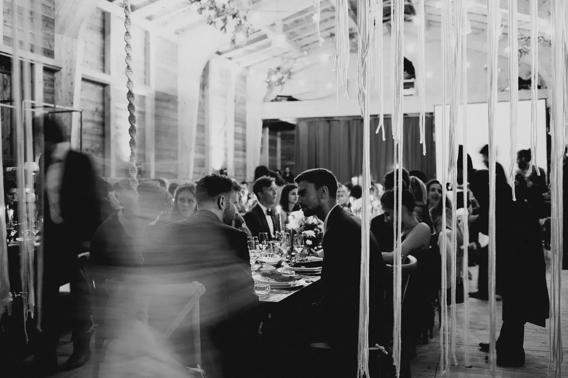 Wedding celebration outside an illuminated building at night