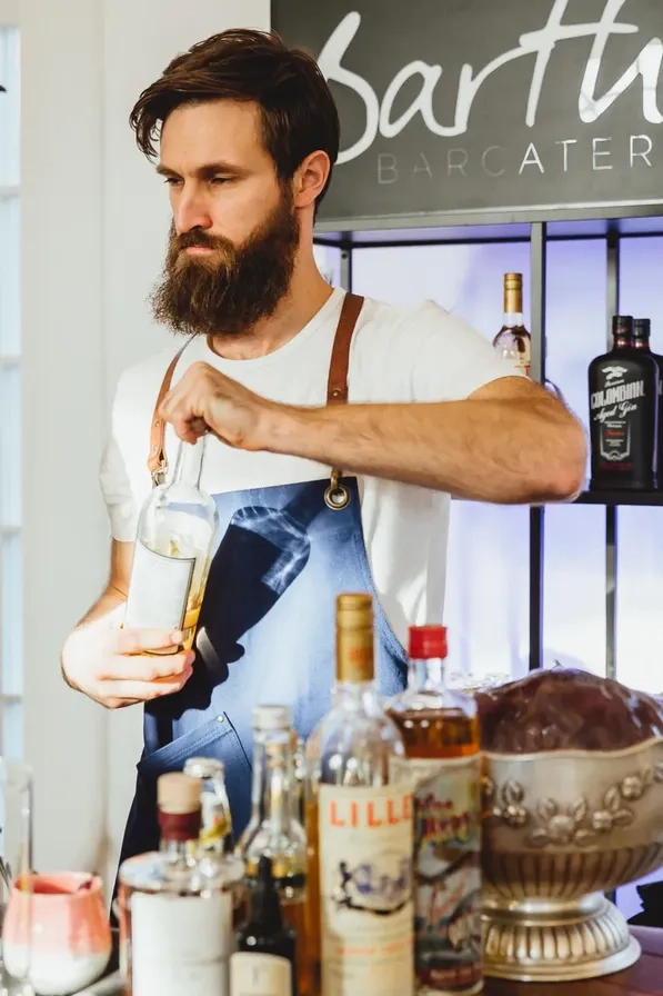 Man preparing a drink at a stand