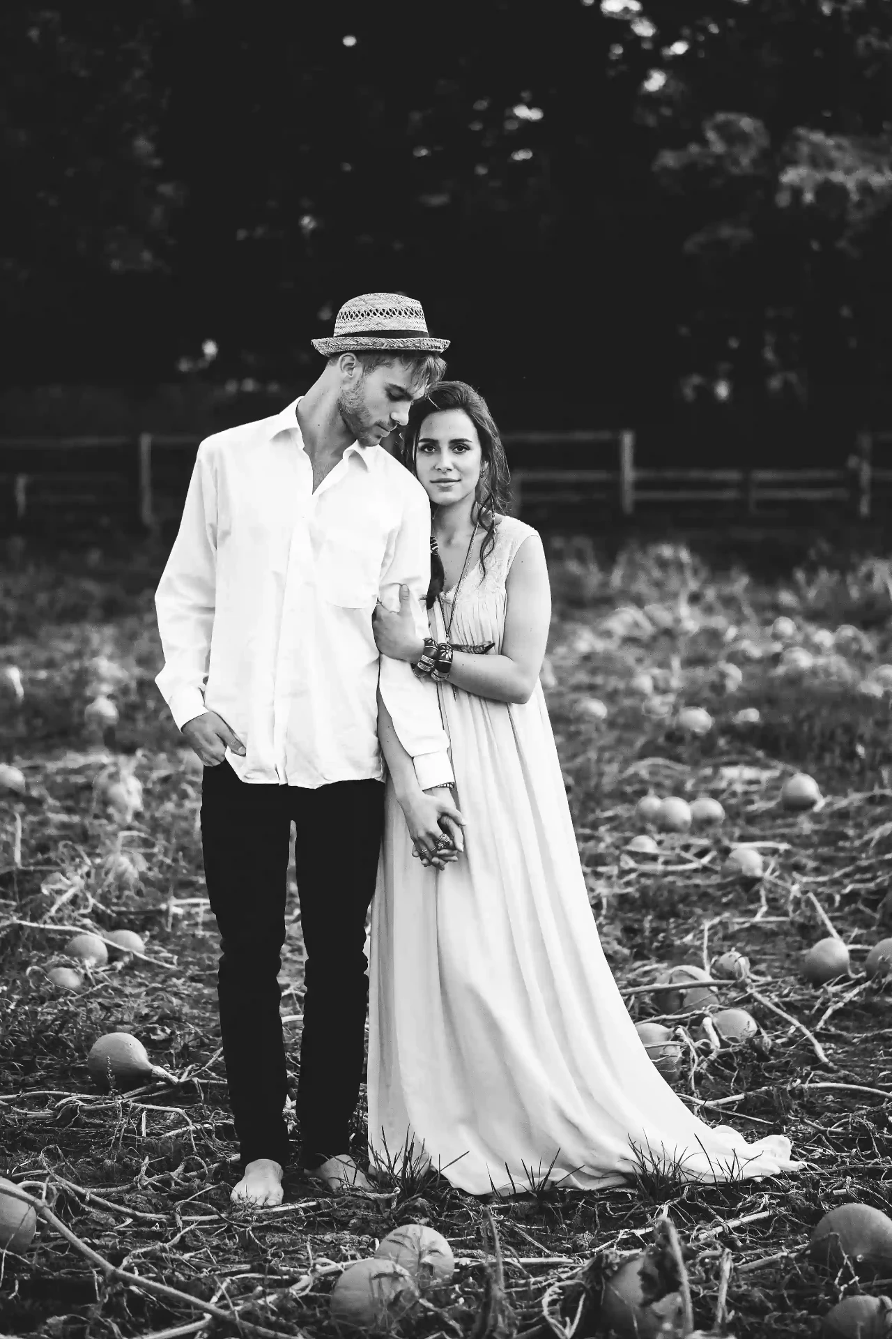 Groom sitting on a small rustic cart in a garden
