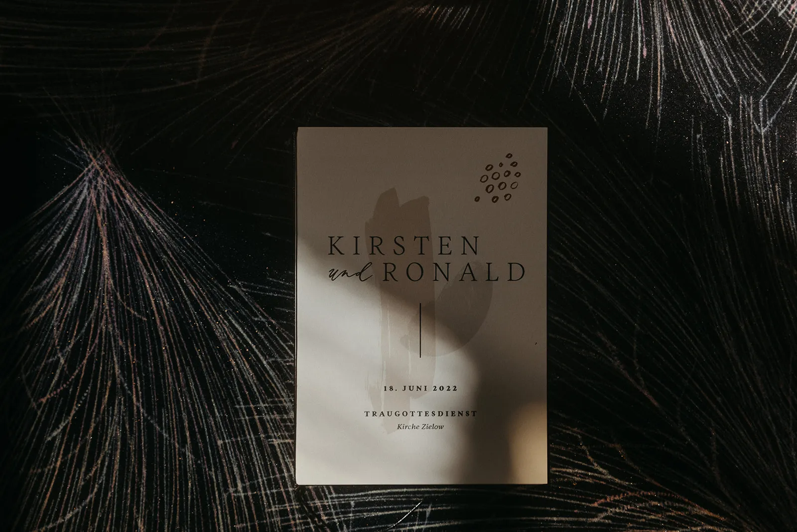 Wedding details and stationery on a table