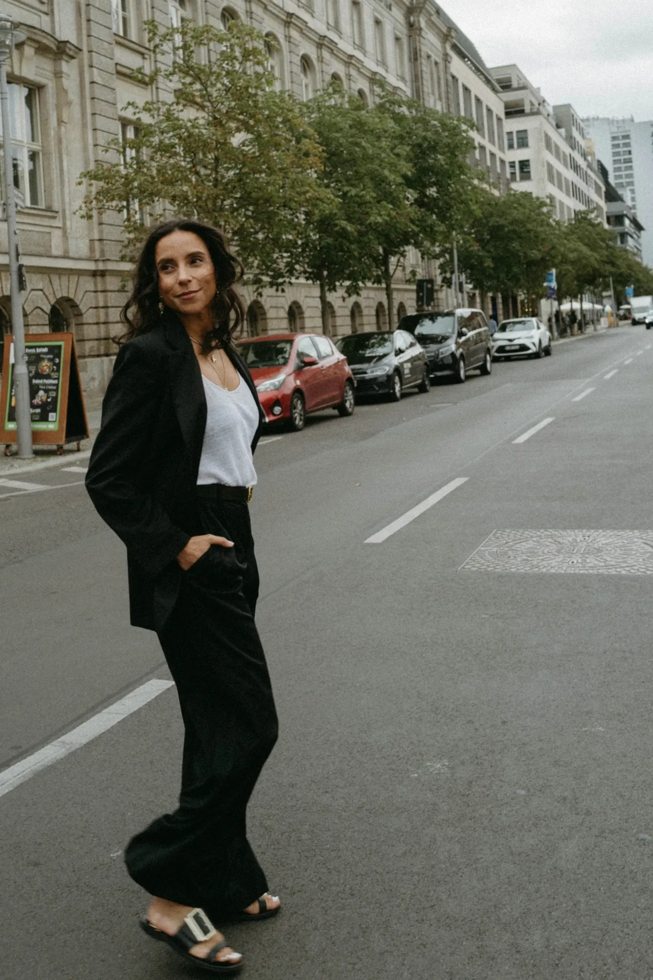 Woman wearing a black outfit on a city street