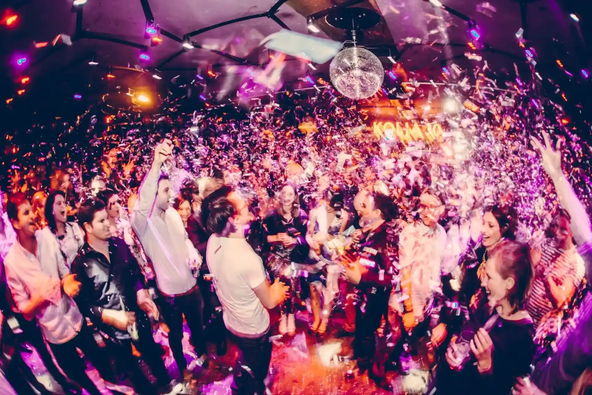 Confetti falling over the dancing crowd