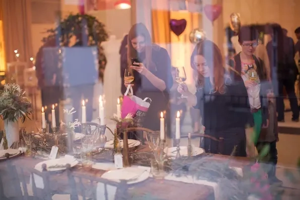 Visitors looking at an installation in an event space