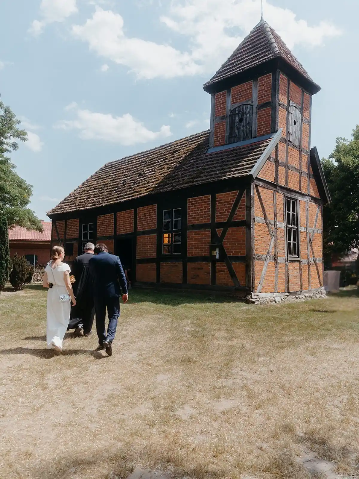 Historic half-timbered building beside a lawn