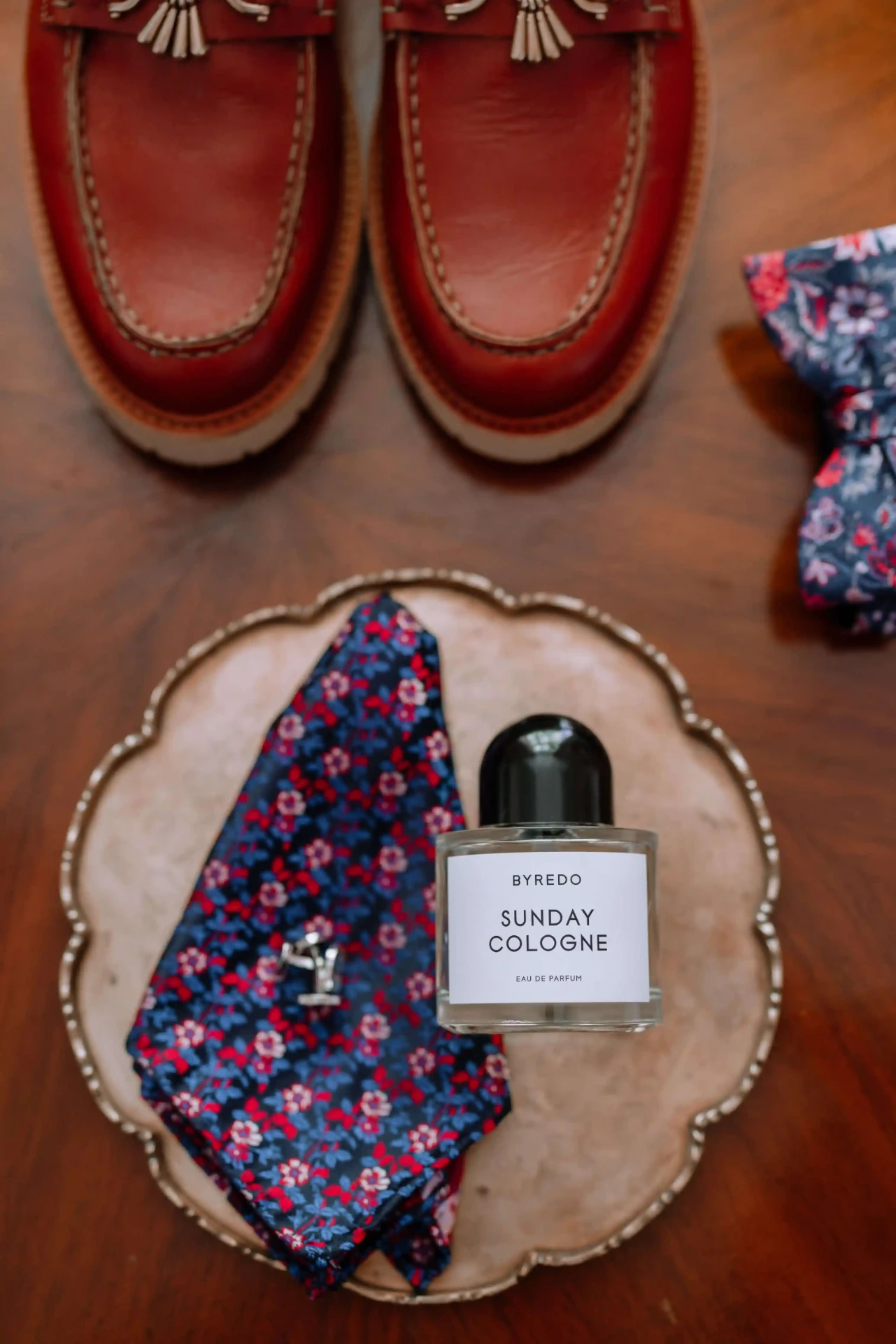 Wedding details with shoes, a bow tie and a name card