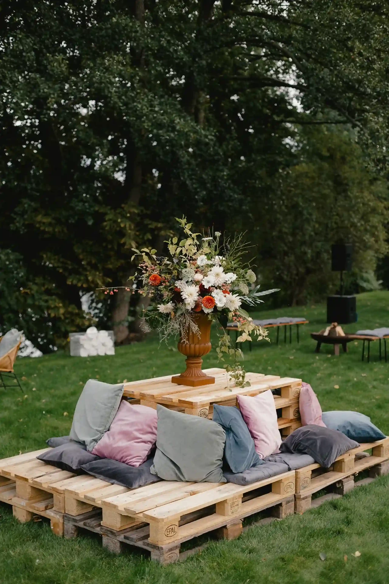 Bride seated outdoors on a lounge with cushions