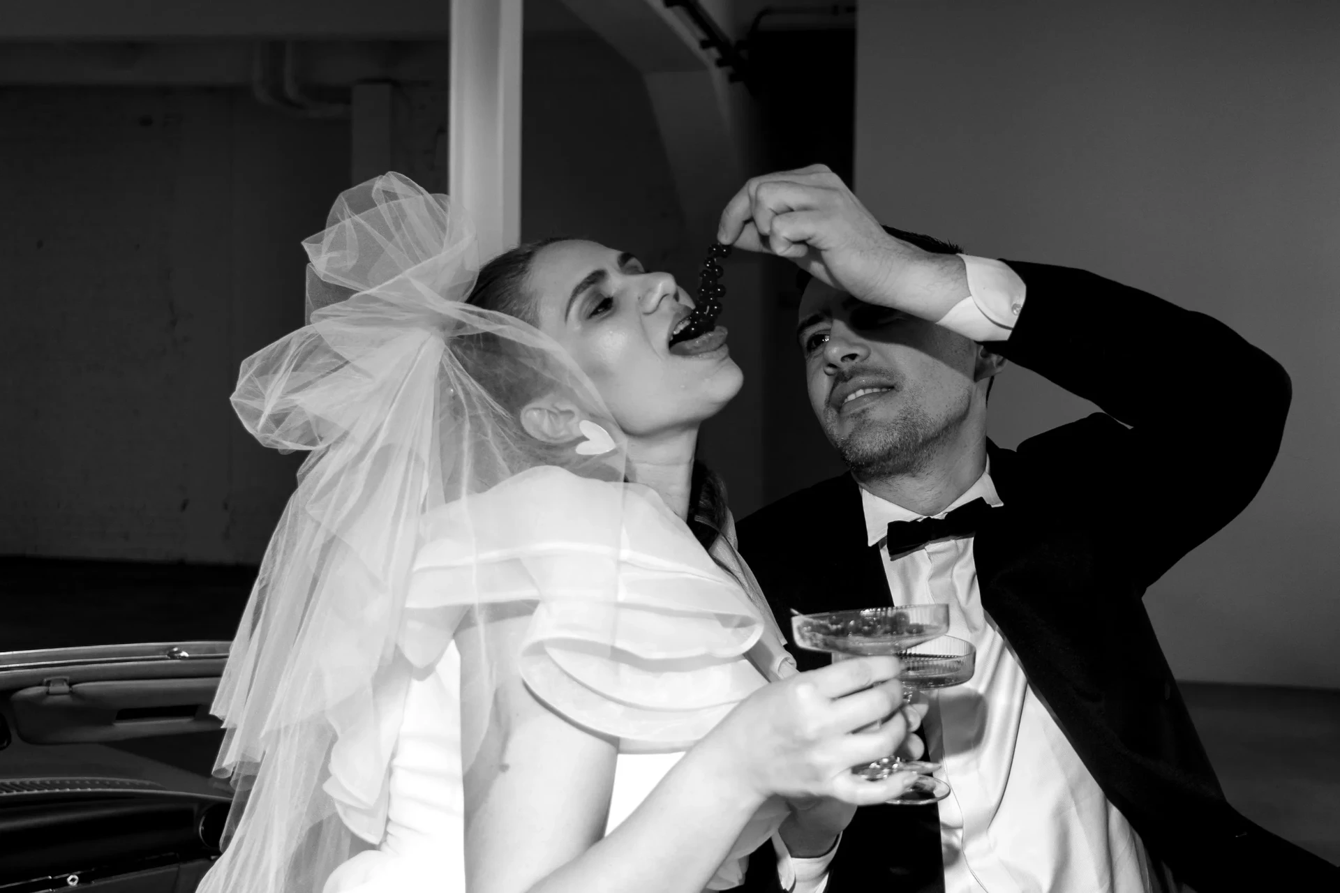 Wedding couple posing in a black-and-white photograph