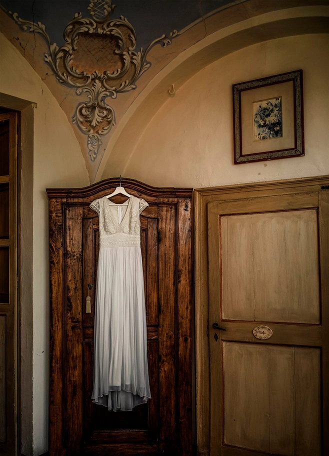 Wedding dress hanging on a door
