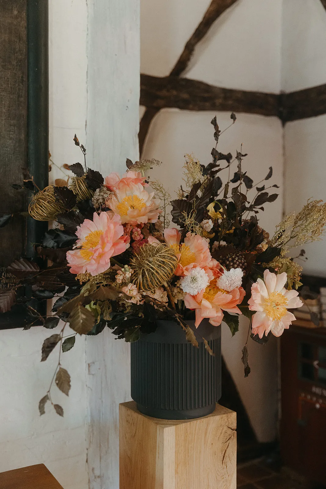 Floral arrangement in a vase against a light background