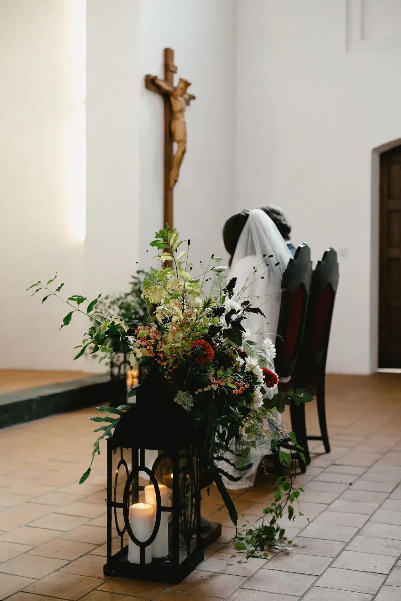 Wedding ceremony with the couple and guests inside a bright church