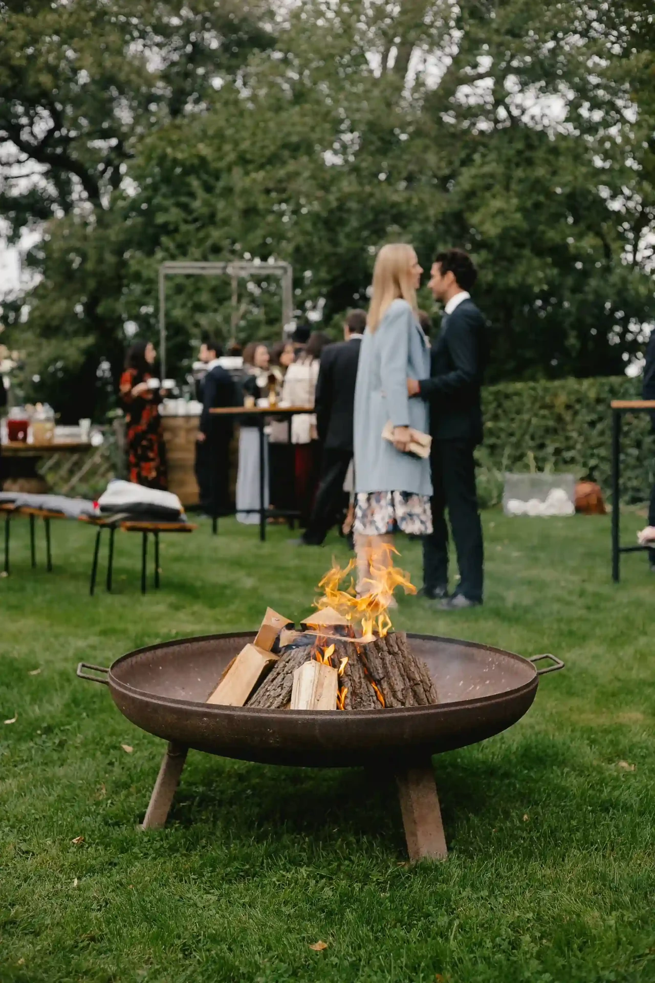 Drinks and flowers arranged on a garden table