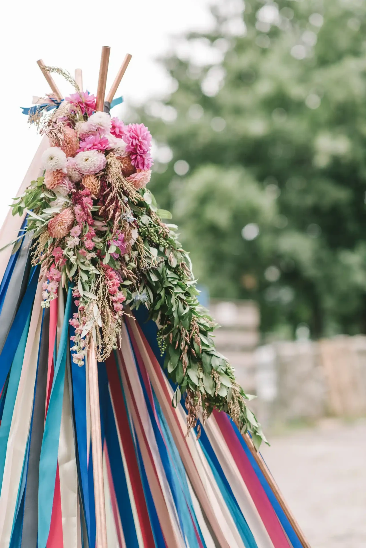 Colourful ribbons and flowers attached to a decorative wedding accessory