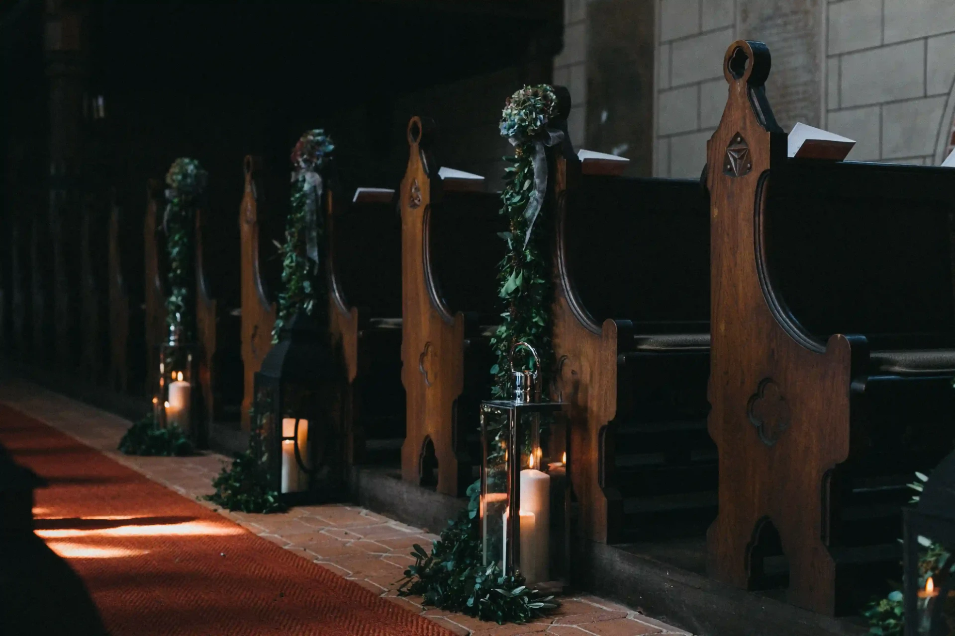 Wedding ceremony in a church lit by candles