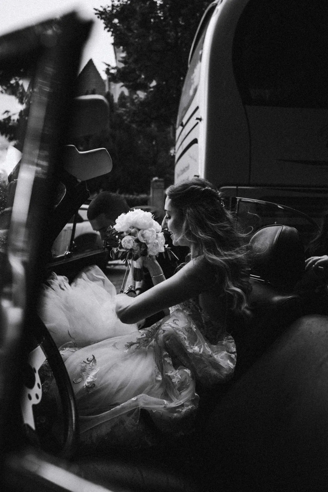 Guests watching the celebration from a row of seats, black-and-white photograph