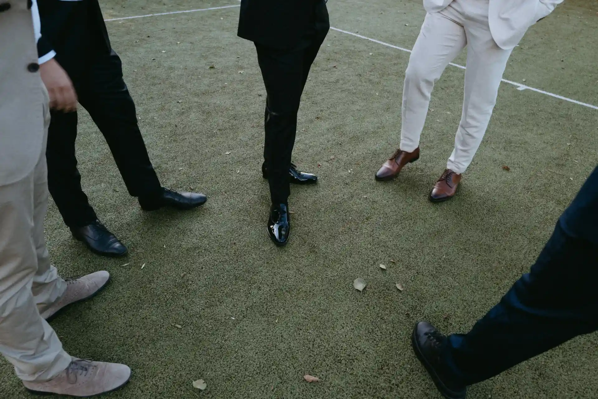 Wedding guests raising their glasses outdoors