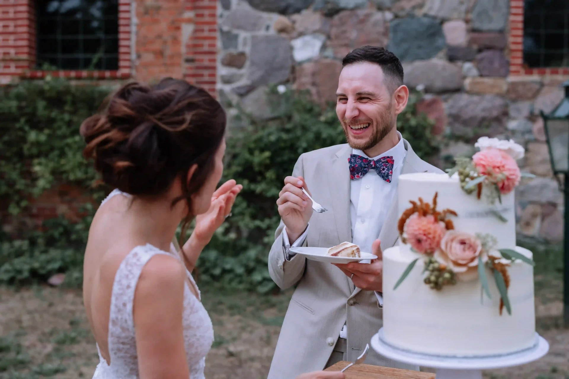 Bride and groom dancing in a barn
