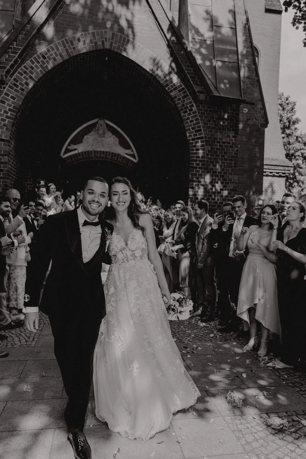 Wedding guests leaving the church together