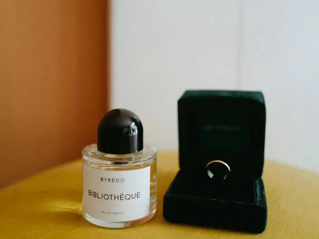 Perfume bottle and jewellery box on a table