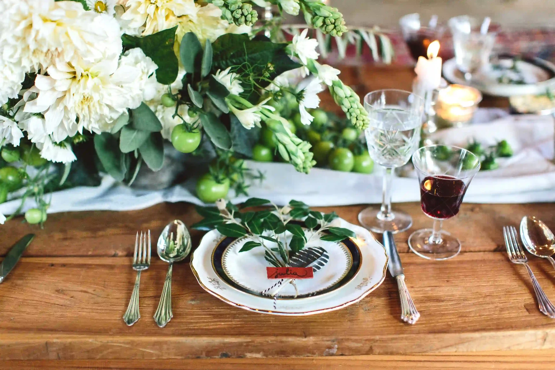Wedding couple seated together at an elaborately decorated wedding table