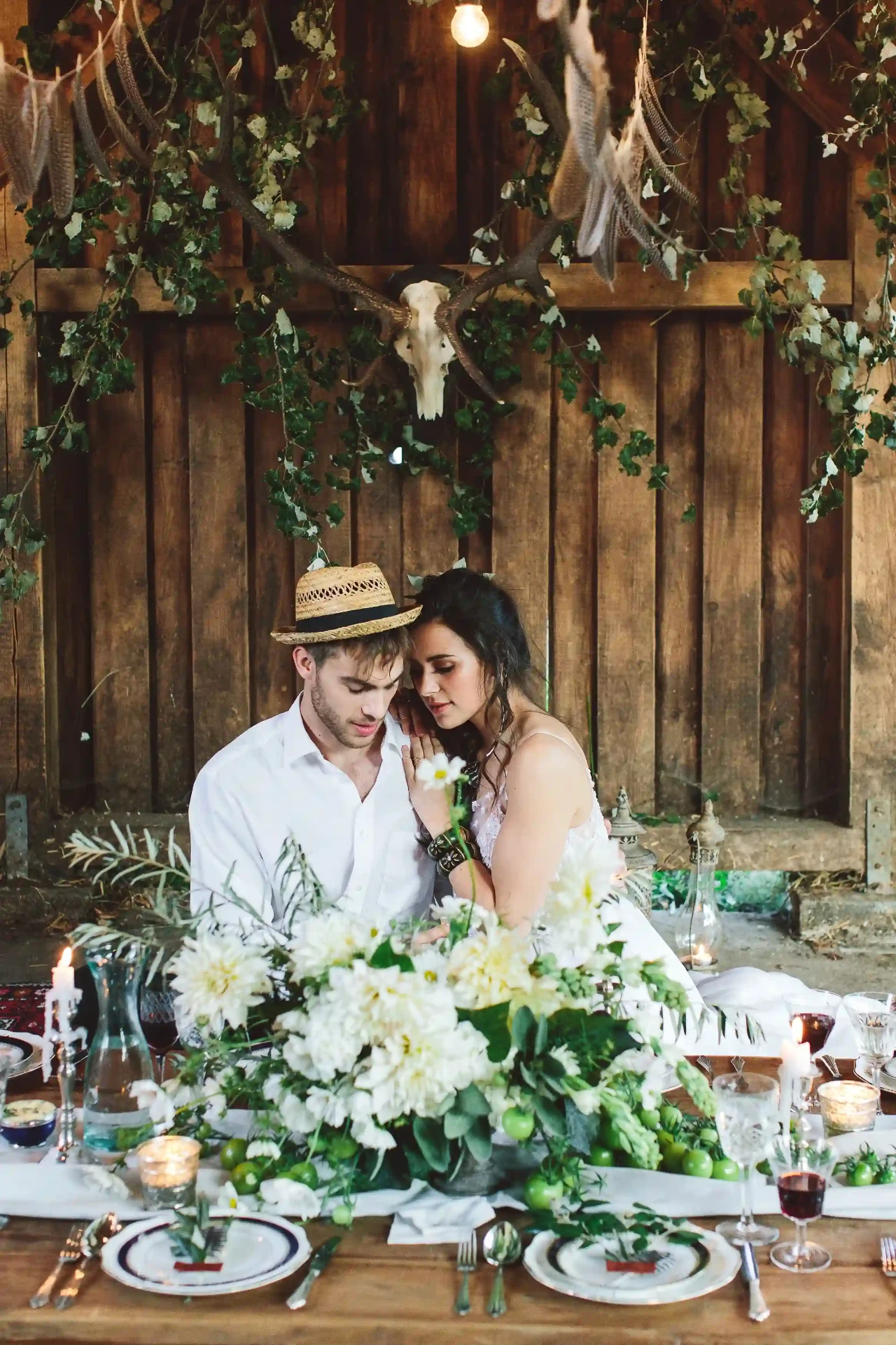 Black-and-white portrait of the wedding couple in a meadow