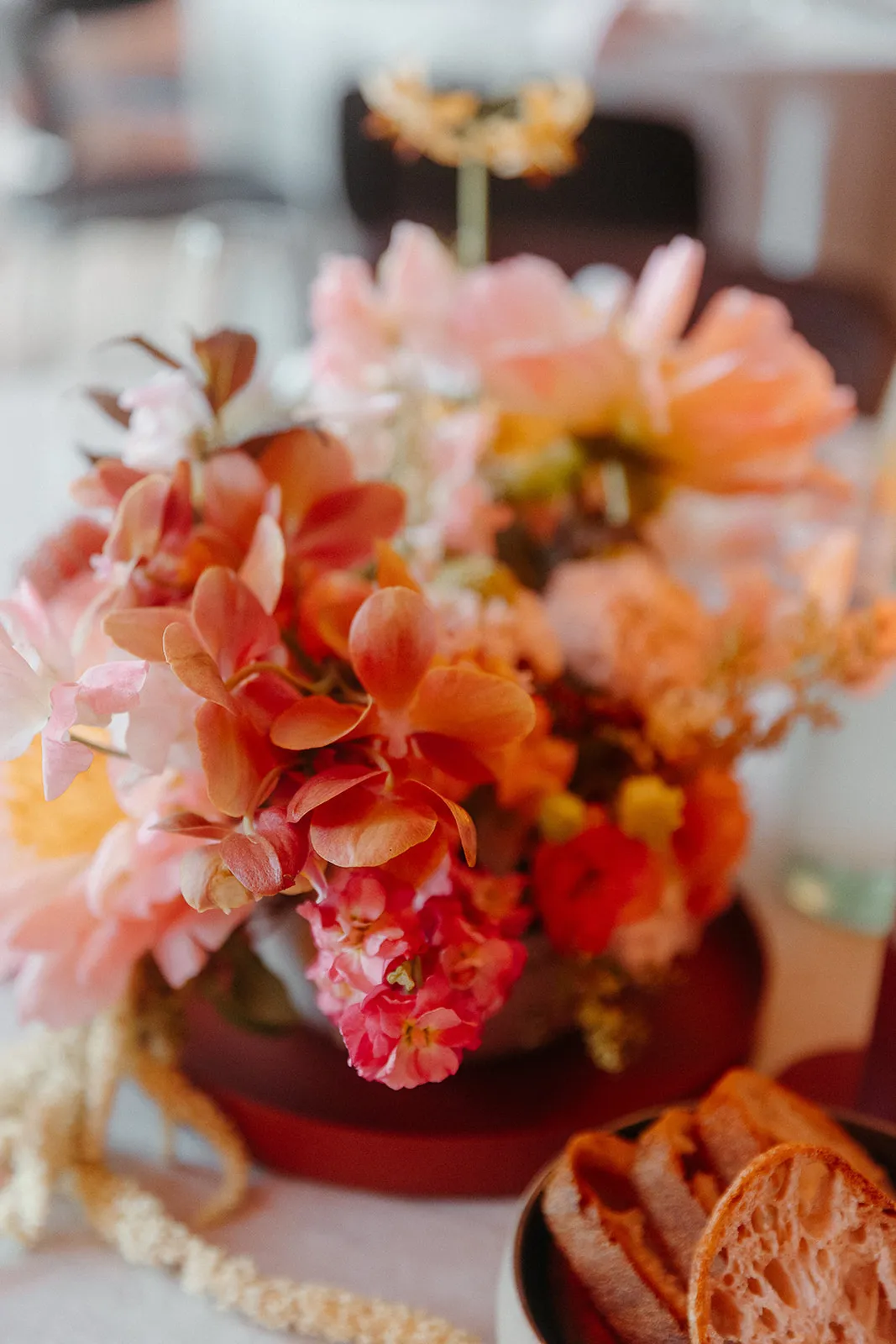 Floral arrangement with pink and orange flowers