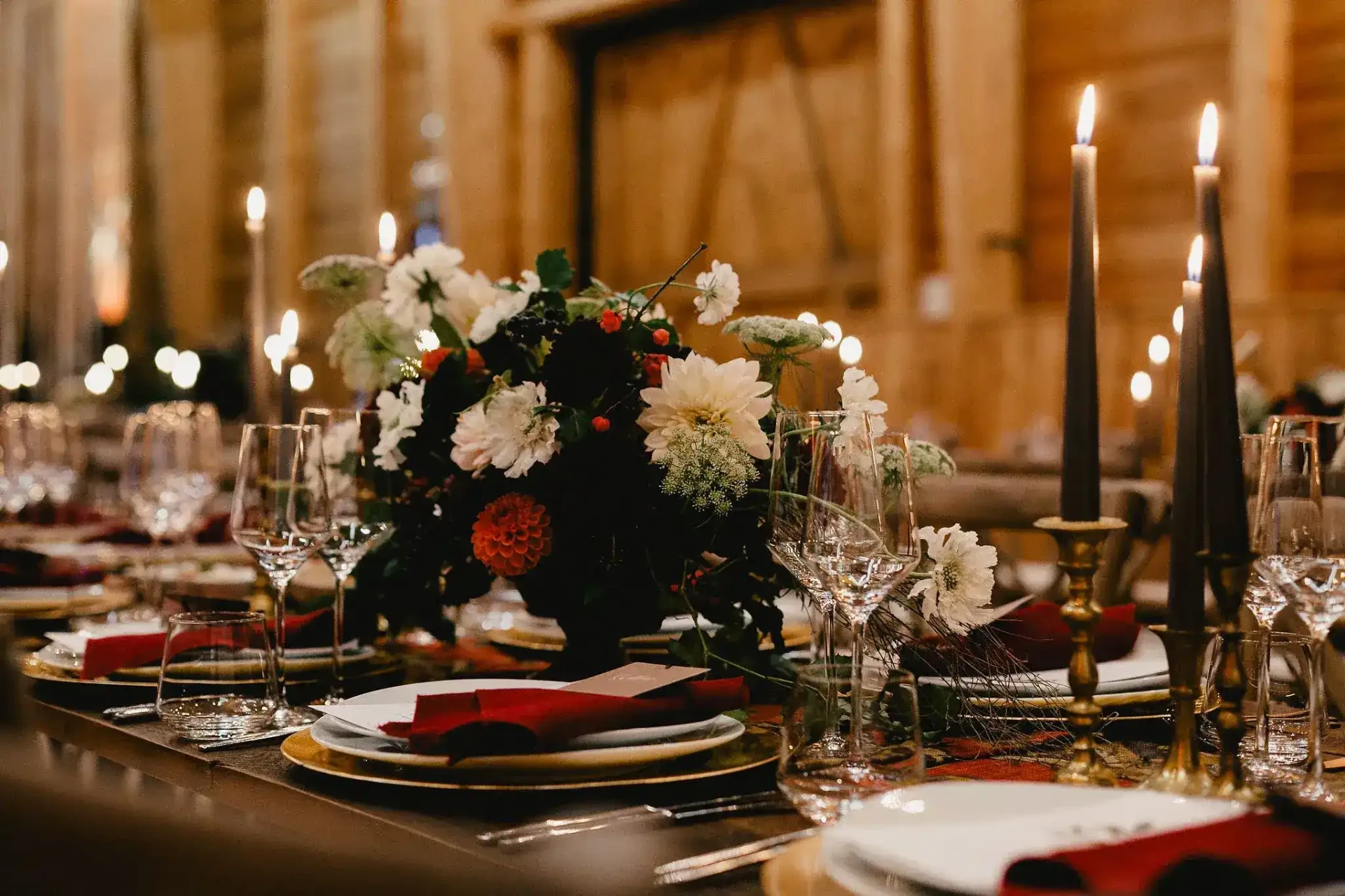 Festively set wedding table with candles and flowers