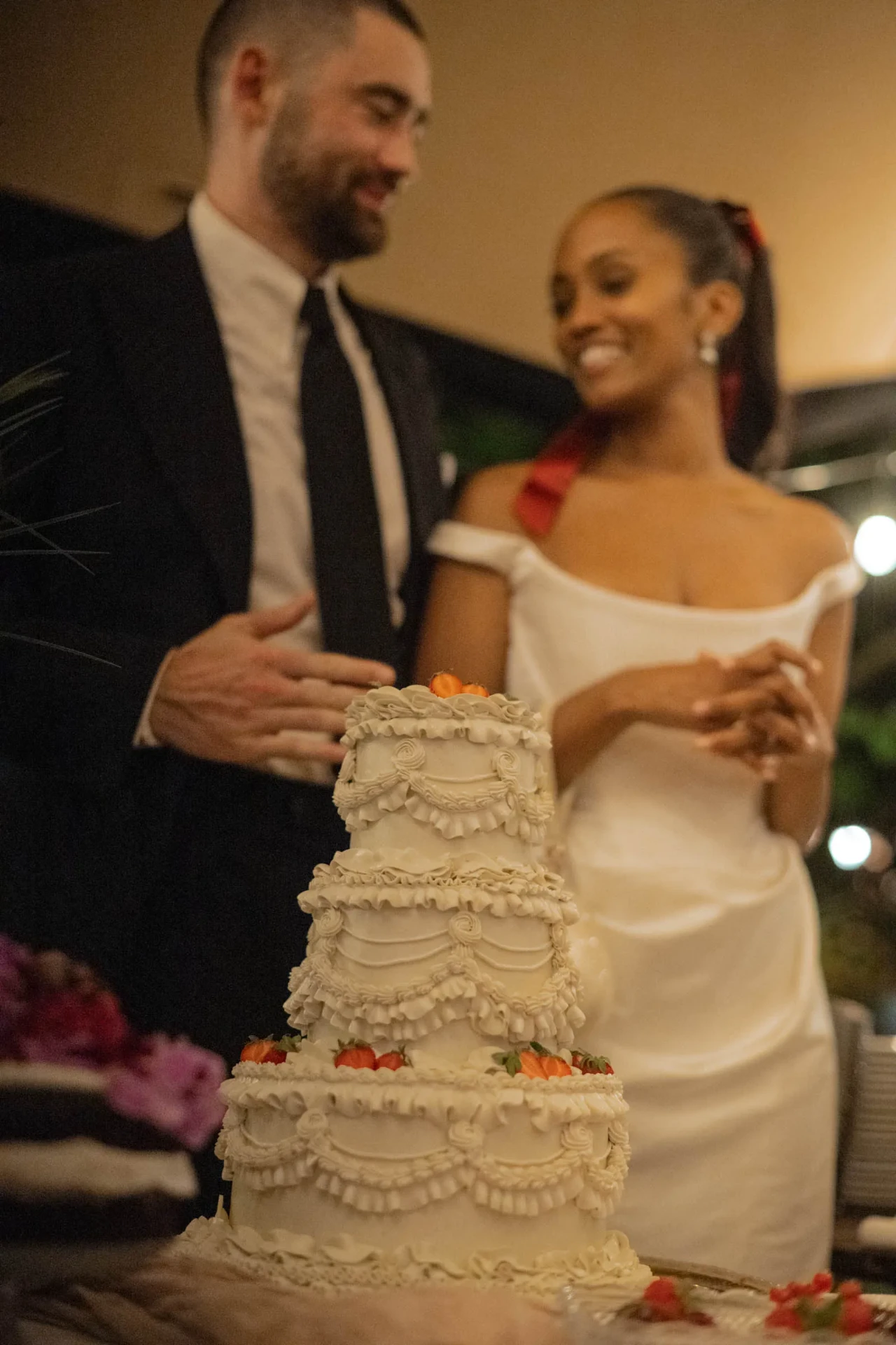 Wedding couple cutting their wedding cake together