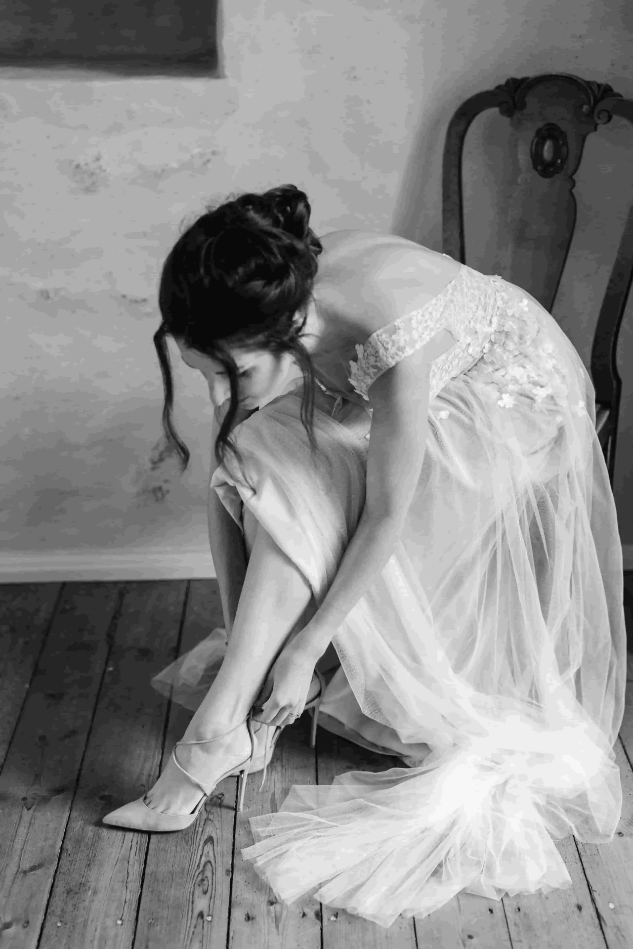 Bride seated in her dress before the ceremony