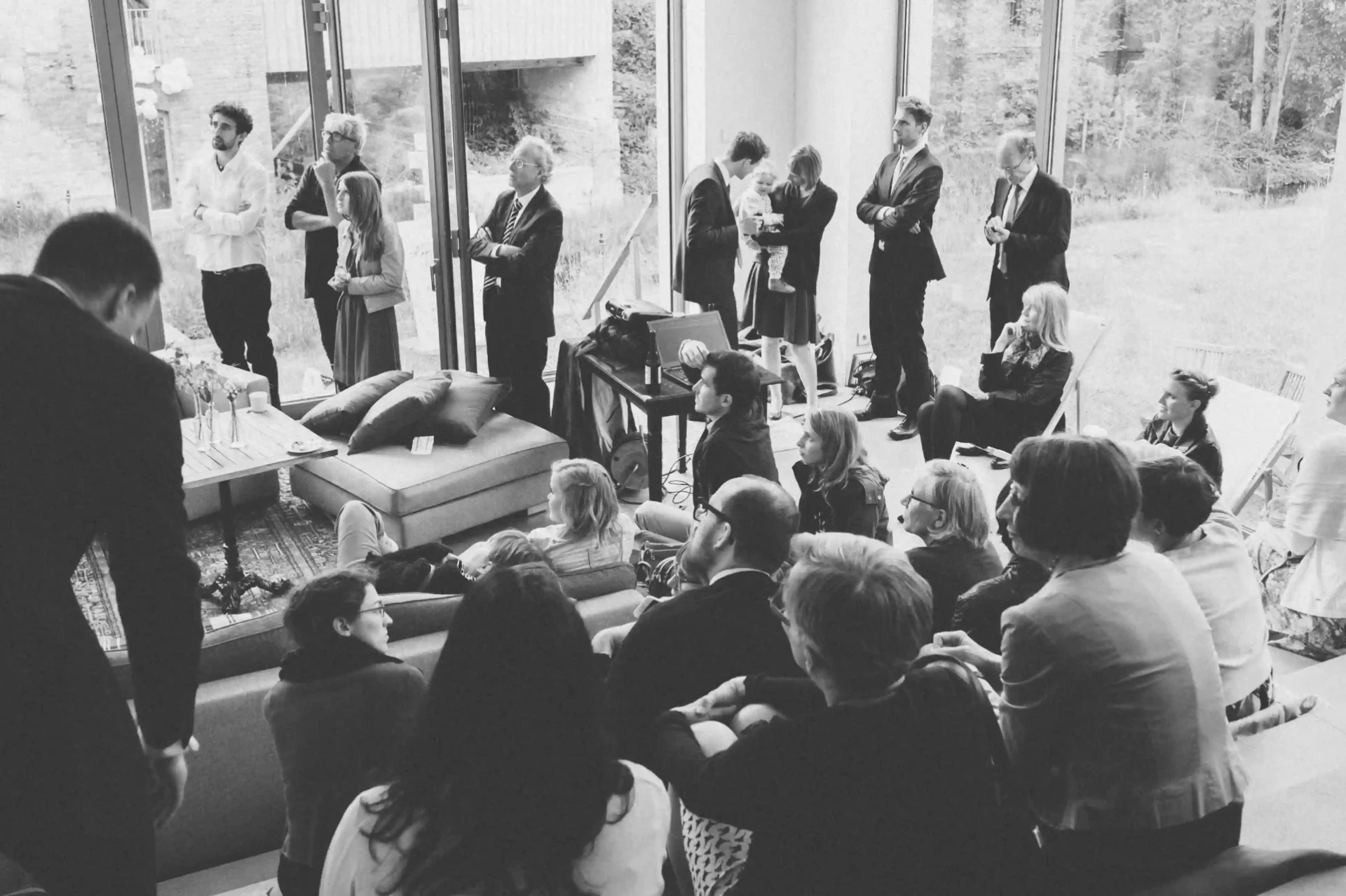 Black-and-white photograph of a church wedding ceremony with seated guests
