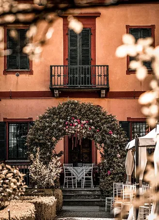 Building façade with abundant floral and plant decoration