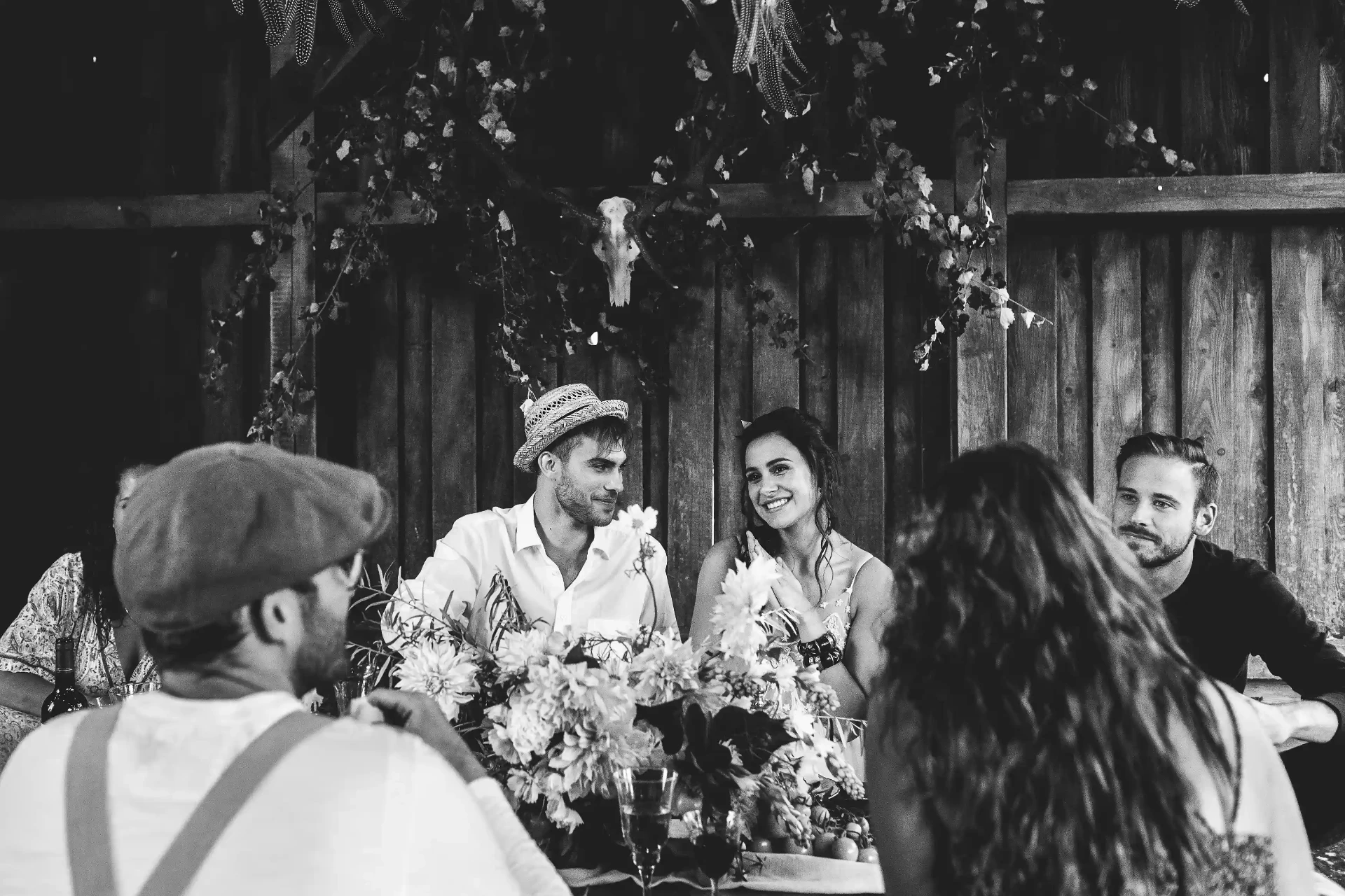 Wedding couple standing among flowers in a garden