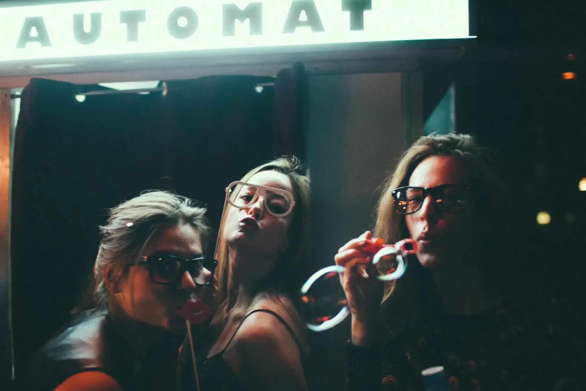 Guests raising their glasses at a vending machine
