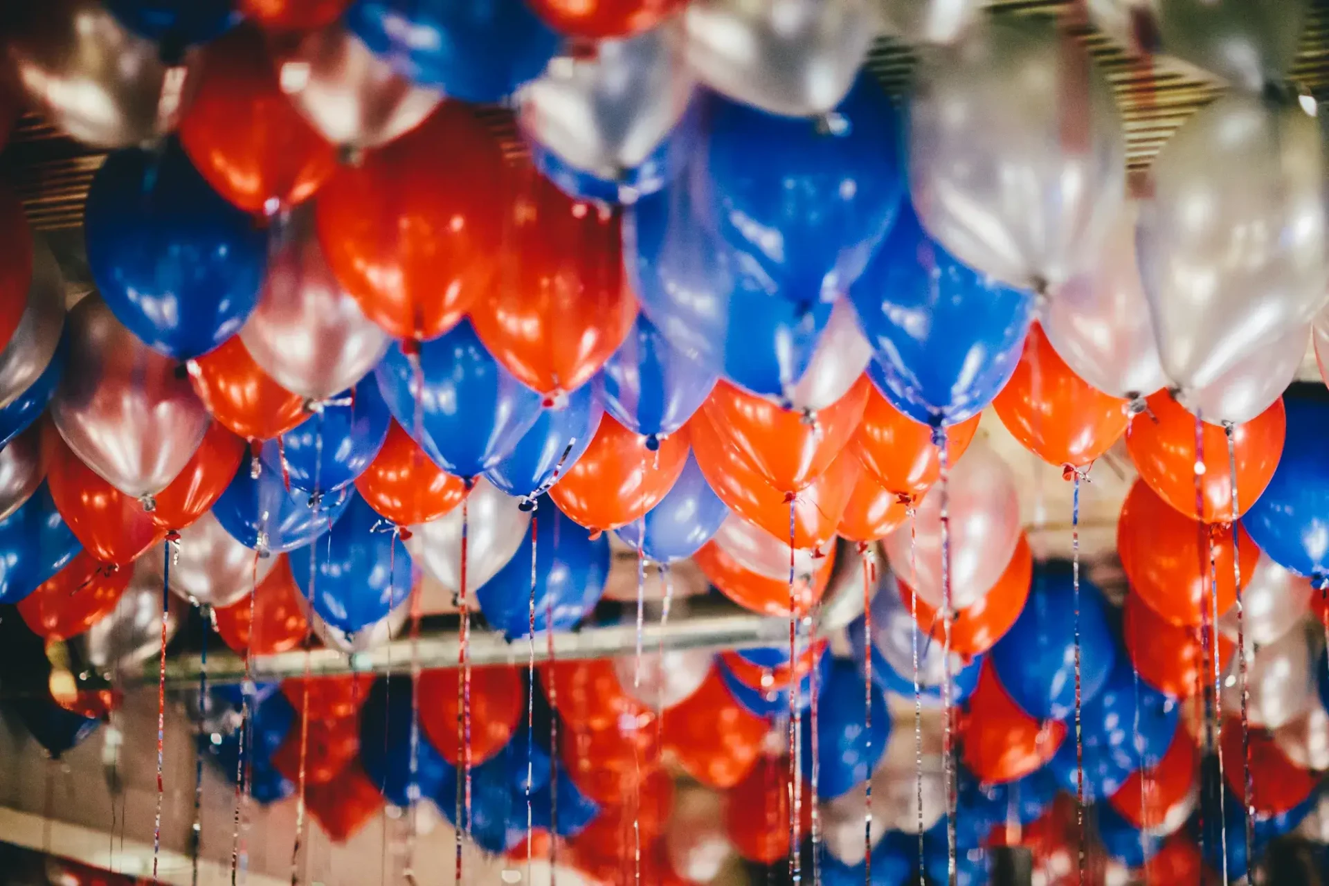 Colourful balloons above a festively set table