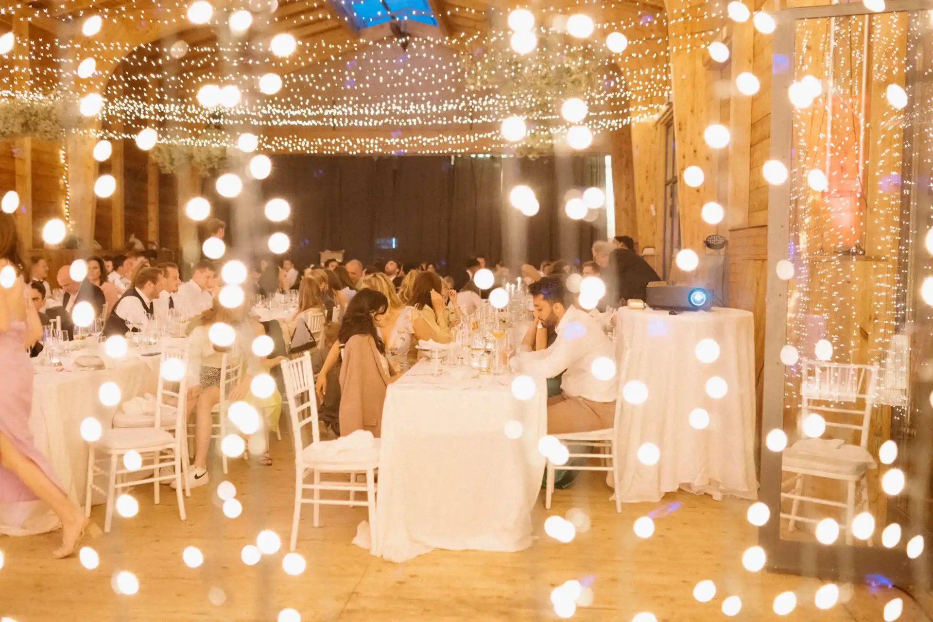 Wedding table set with white linen and crystal glasses