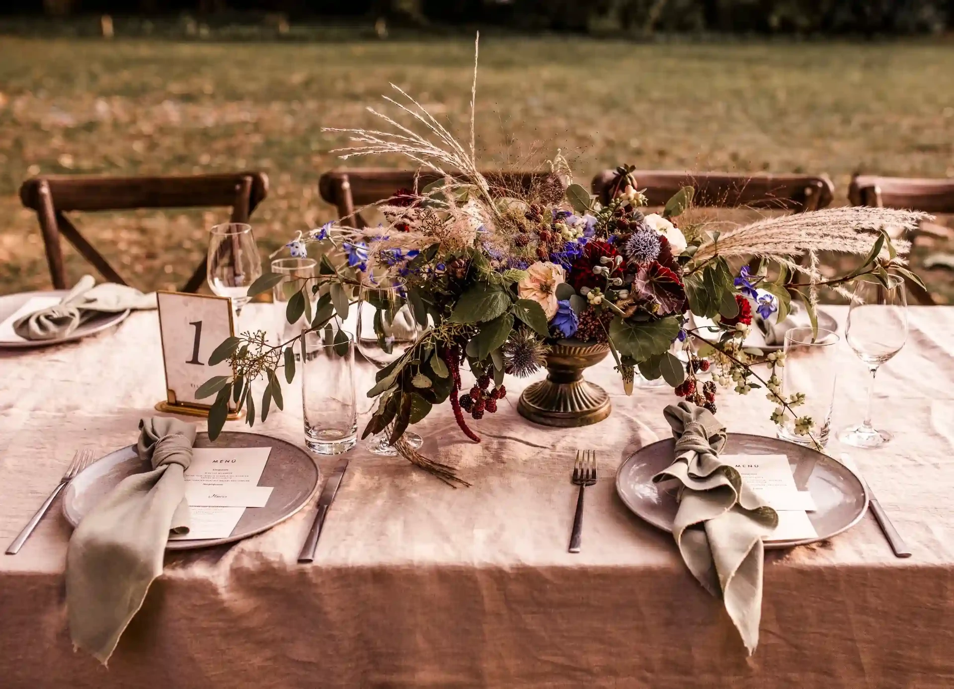 Close-up of a wedding table set with flowers and candles