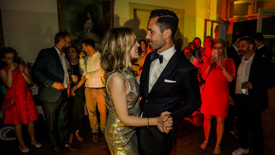 Bride and groom dancing at an evening celebration